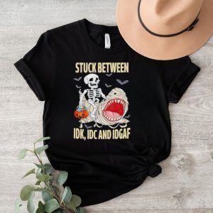 Skeleton riding shark stuck between Idk Idc and Idgaf shirt